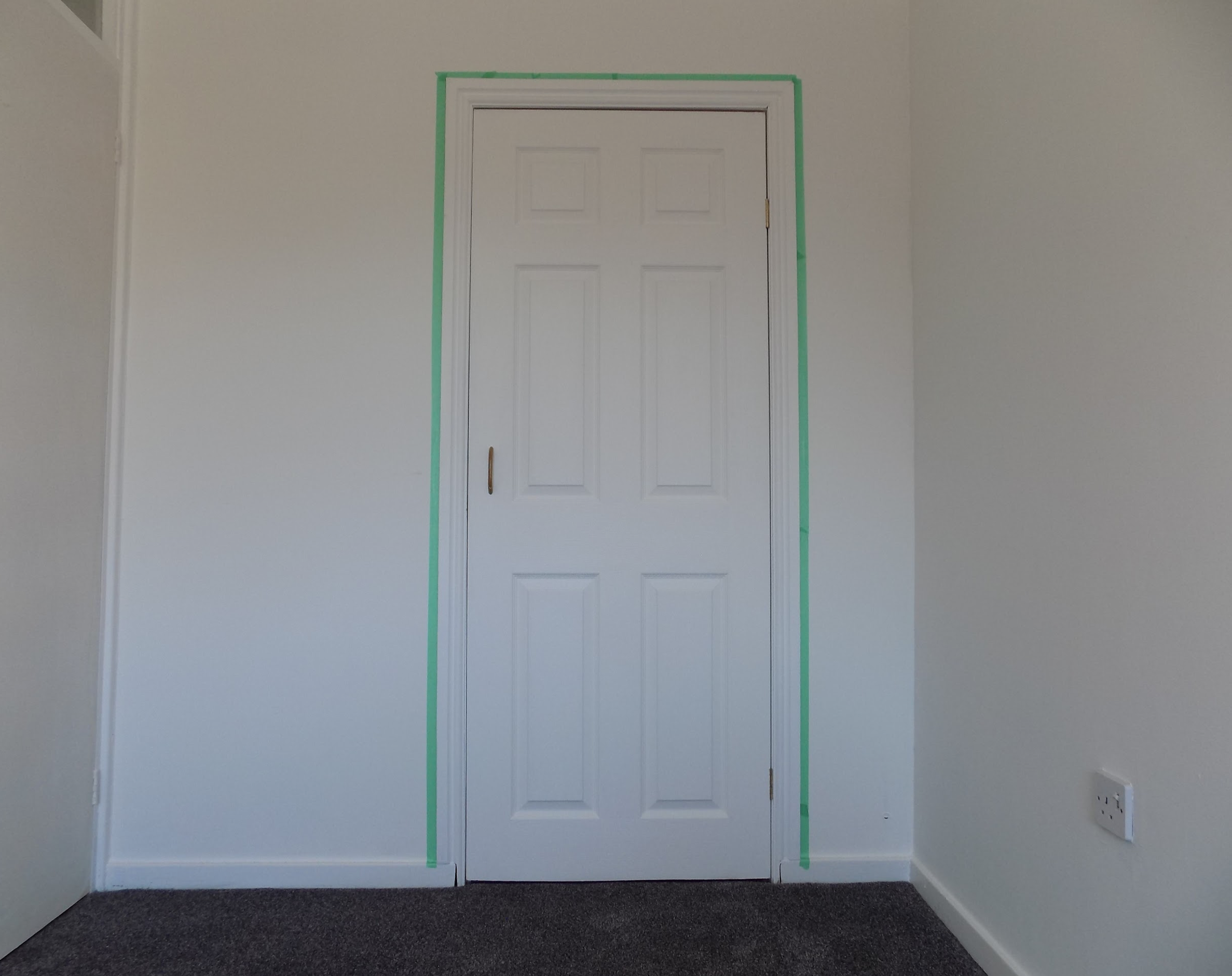 empty room, door tape around edges
